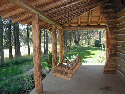 Secluded log cabin porch